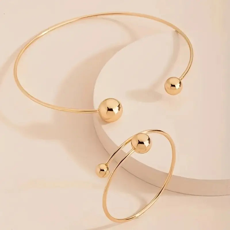 Set aus minimalistischen Gold-Halsband und Armreifen