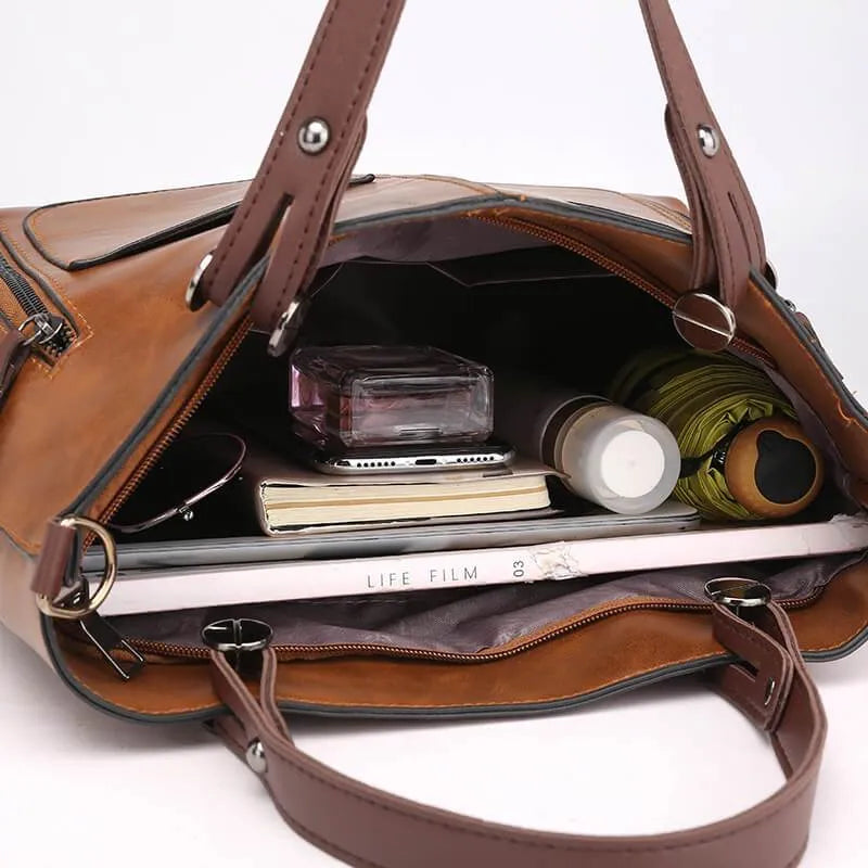 Elegante Handtasche aus hochwertigem pflanzlich gegerbtem Leder mit doppelten Fächern und Vintage-Charme