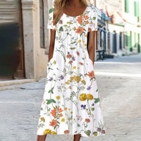 Eloise – Maxikleid im Bohemian-Stil mit Blumenmuster und Taschen | Kurzärmliges Maxikleid mit Blumenmuster im Boho-Chic-Stil für Damen in Weiß