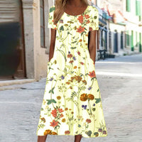Eloise – Maxikleid im Bohemian-Stil mit Blumenmuster und Taschen | Kurzärmliges Maxikleid mit Blumenmuster im Boho-Chic-Stil für Damen in Gelb