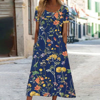 Eloise – Maxikleid im Bohemian-Stil mit Blumenmuster und Taschen | Kurzärmliges Maxikleid mit Blumenmuster im Boho-Chic-Stil für Damen in Dunkelblau