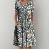 Emma - Bohemian-Midikleid mit Blumenmuster und Taschen | Lässiges Sommer Midikleid mit Blumenmuster in Blau mit Blumben