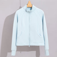Damen Performance-Trainingsjacke mit Stehkragen und Daumenloch Nord Taschen in Himmelblaues Oberteil