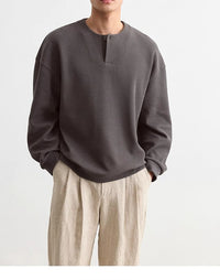 Herren Strukturierter Oversize-Strickpullover mit Henley-Knopfleiste Nord Taschen in Felsgrau