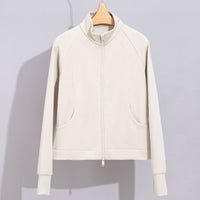 Damen Performance-Trainingsjacke mit Stehkragen und Daumenloch Nord Taschen in Mandelfarbenes Oberteil