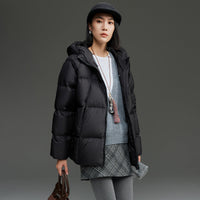 Damen Kurz geschnittene Boxy‑Steppjacke mit abnehmbarer Kapuze und Thermo‑Isolierung Nord Taschen in Schwarz