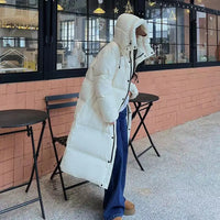 Lange Puffer Daunenmantel in Beige