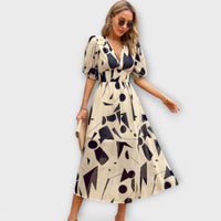Maxikleid mit Ballonärmeln im abstrakten Design in Beige